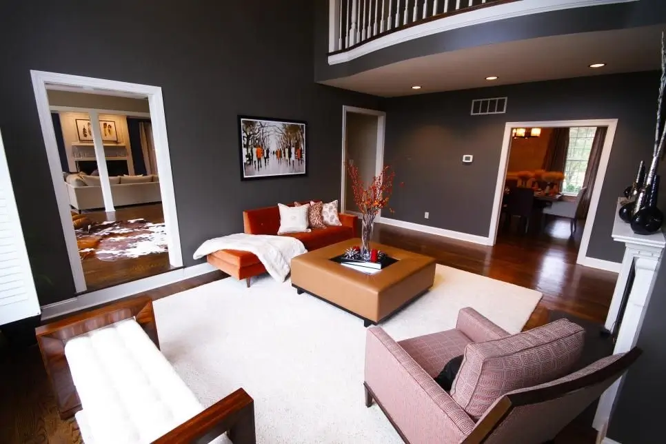 A living room with a bold accent wall.