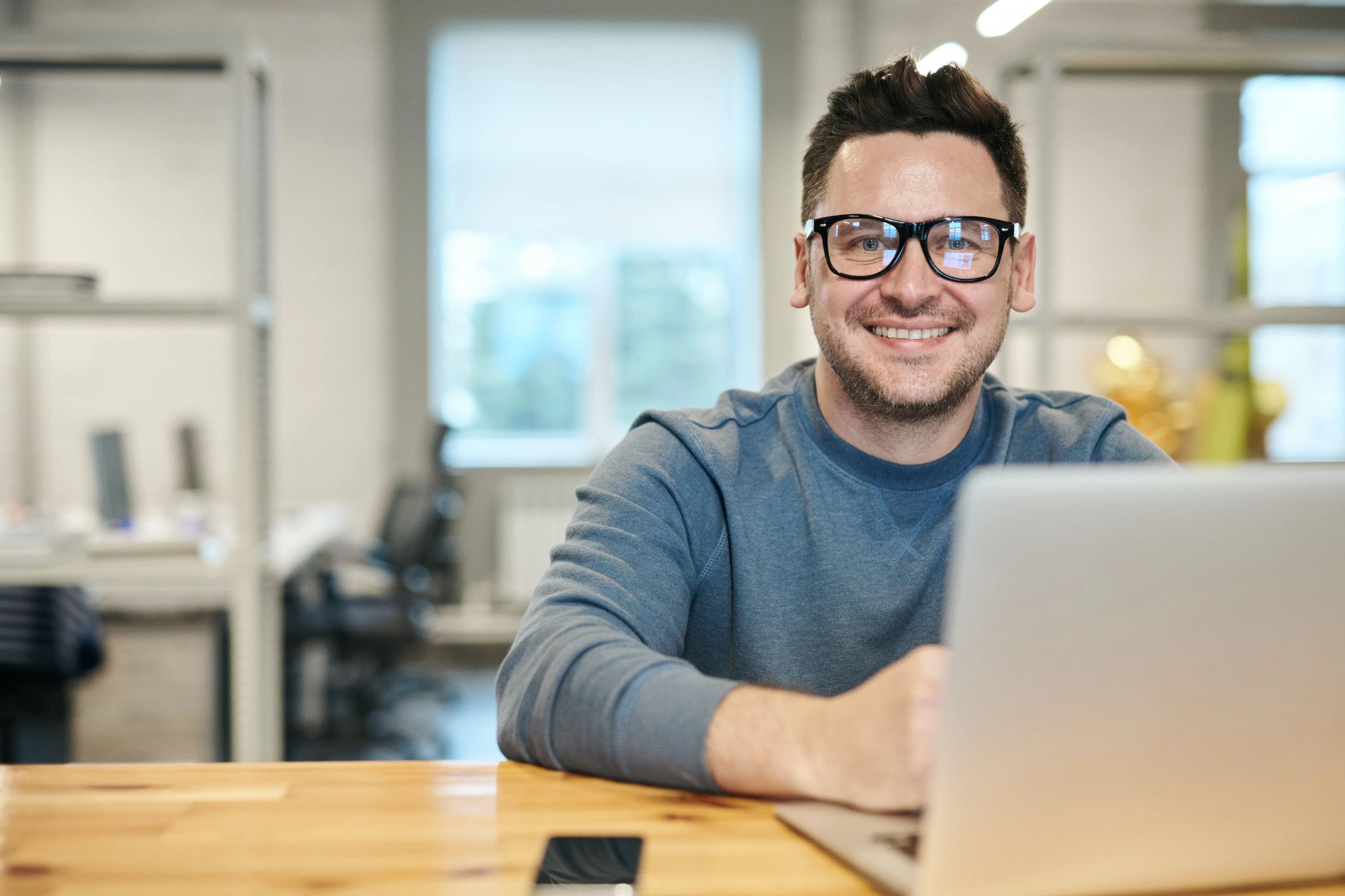 A professional and friendly portrait of the studio's founder.