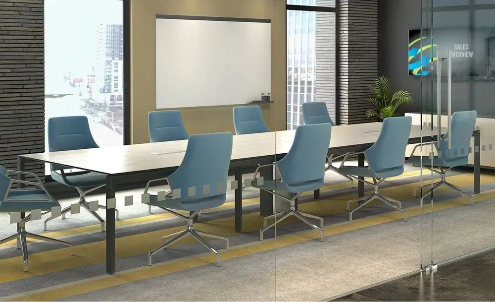 A meeting table with chairs in a modern office.
